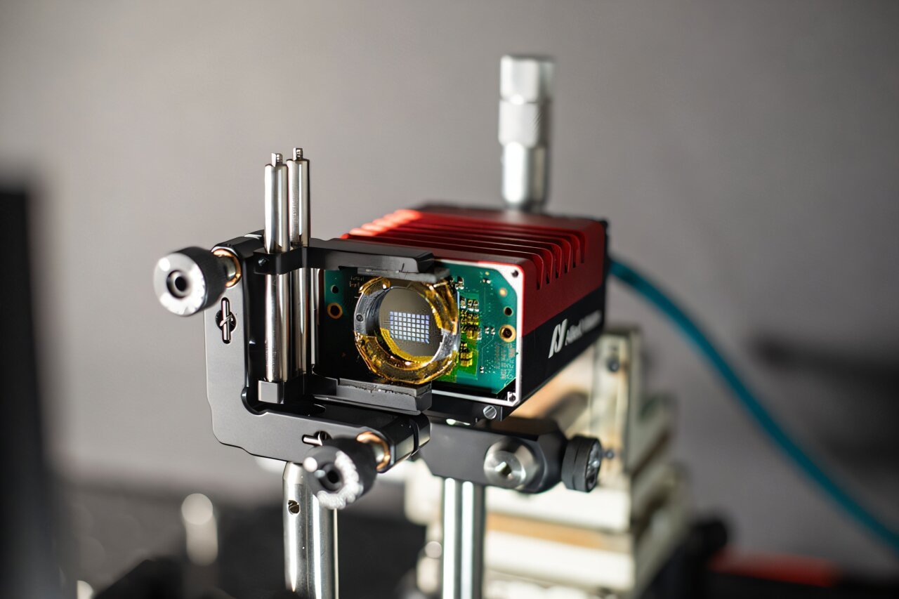 University of Washington professor Arka Majumdar and his students collaborated with Princeton University to build a new type of compact camera engineered for computer vision. Their prototype, shown here, uses optics for computing, significantly reducing power consumption and enabling the camera to identify objects at the speed of light. Courtesy of Ilya Chugunov/Princeton University.