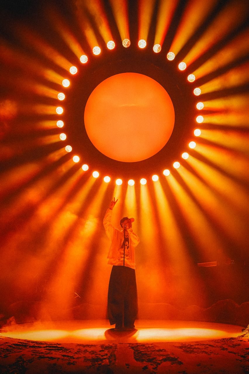 Person singing in front of light